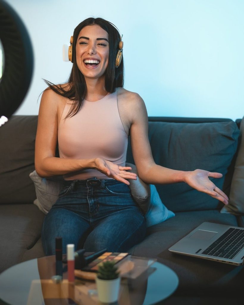 female-influencer-vlogging-online-with-smartphone-cam-and-laptop-from-home-e1651201762745-po25ljppivf7adkfosu1efjwtusoaz4d753tze6fb4
